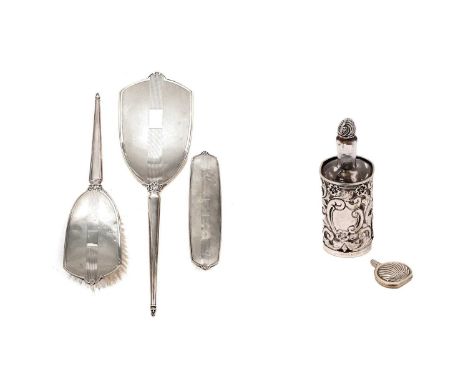 An Elizabeth II silver dressing table set by Charles S Green &amp; Co Ltd, Birmingham, 1966, comprising hand mirror, hairbrus