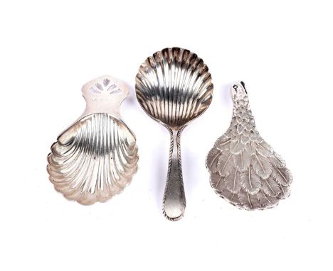 Three silver caddy spoons, comprising: an Elizabeth II silver Eagle's Wing pattern caddy spoon, by C J Vander Ltd, London 197