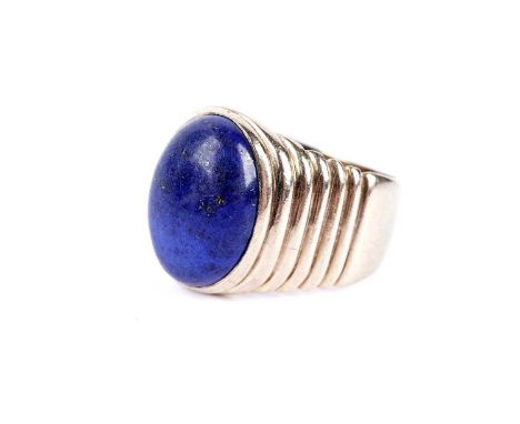 A lapis lazuli cabochon dress ring, in 9ct yellow gold, size R, 9.5g gross.
