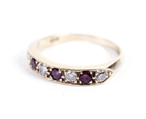 A ruby and diamond half-hoop eternity ring, on an 18ct gold shank, size Q, 3.4g gross.