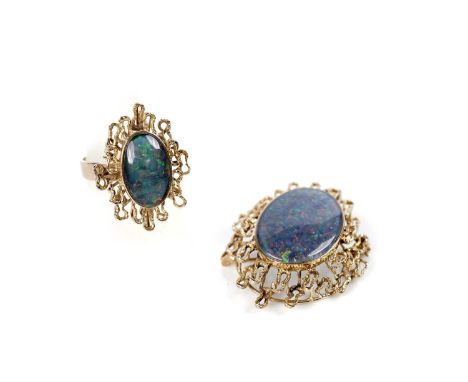 An opal and gold ring and brooch/pendant, the oval triplet opal cabochon measuring 15.5 x 10.0mm, with 14ct yellow gold surro
