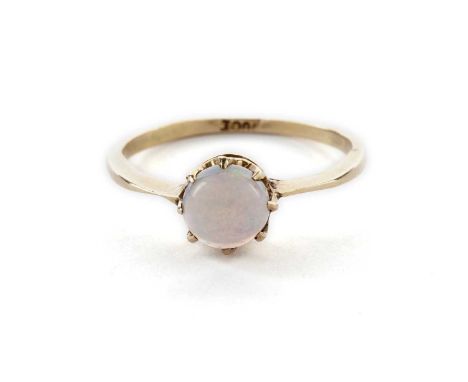 A single stone opal ring, set with a circular opal cabochon, in yellow gold, stamped '18ct', size K, 1.7g gross.