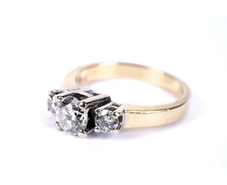 A diamond three stone ring, the central round brilliant cut diamond weighing approximately 0.50 carats, in white gold setting