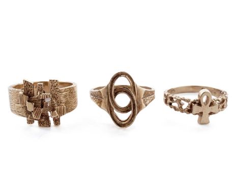 A 9ct yellow gold Egyptian Ankh motif dress ring, size K; and two other 9ct yellow gold dress rings, 9.5g gross.