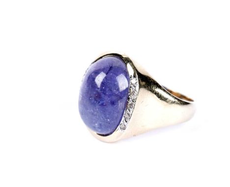 A tanzanite cabochon and diamond dress ring, in 14ct yellow gold, size S, 7.8g gross.