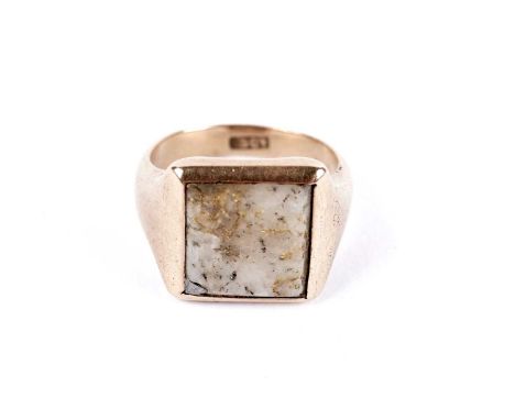 A quartz signet ring, in yellow gold, stamped '15ct', size N 1/2, 8.2g gross.