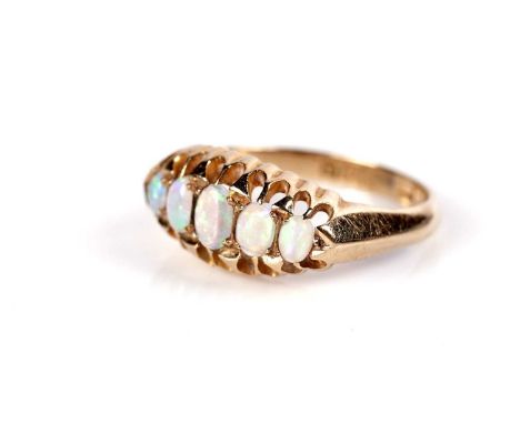 An antique opal ring, with five graduated opals claw-set to the navette face, on an 18ct gold shank, Birmingham, 1919, size K