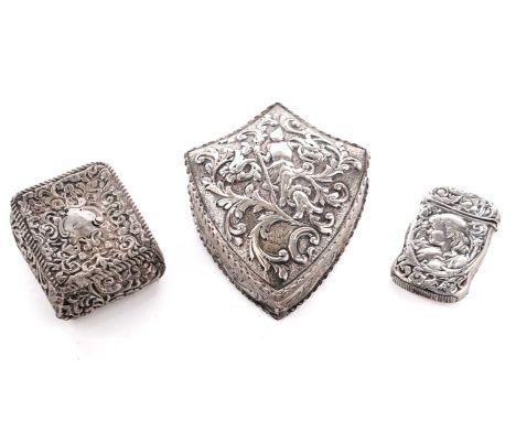 A Victorian silver trinket box, by Thomas Johnson II, London 1885, of shield form, the cover embossed with a figure of a knig