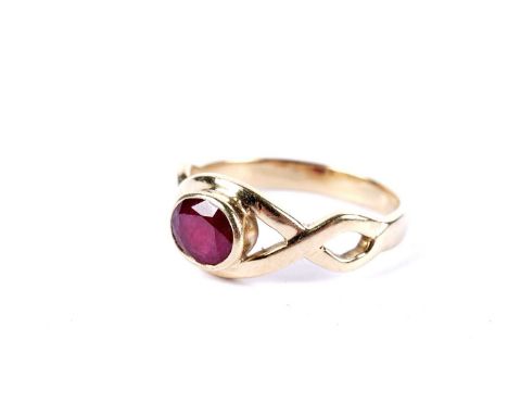 A ruby dress ring, the openwork twist setting in 18ct yellow gold, size Q 1/2, 4.6g gross.