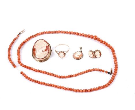 A collection of 9ct gold mounted carved shell cameo jewellery, including: a pair of stud earrings; a brooch; a ring; and a pe
