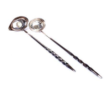 A Georgian silver toddy ladle, by George Knight, London 1823, the bowl inset with Queen Anne coin, on twisted baleen handle, 