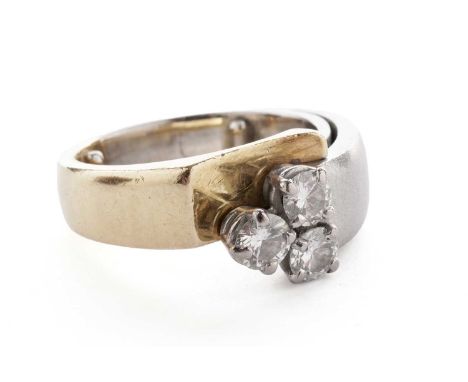 A contemporary three stone diamond ring, the trefoil of round brilliant-cut diamonds totalling approximately 0.66 carats, on 
