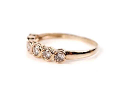 A six stone diamond ring, the brilliant-cut diamonds weighing a total of approximately 1.00carats, in 18ct yellow gold collet