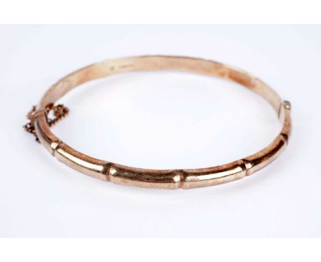 A 9ct yellow gold bangle, of bamboo pattern design, 68mm wide, 8.0g gross.