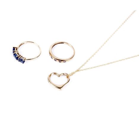 A heart-shaped yellow gold pendant, stamped '375', on yellow gold chain necklace, stamped '10K', 1.6g gross; a blue stone and