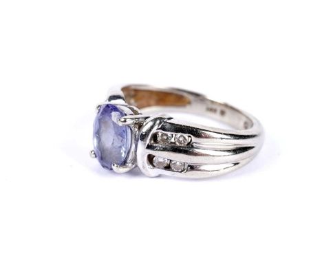 A tanzanite and diamond dress ring, in white gold, stamped '14K', size H, 3.5g gross.