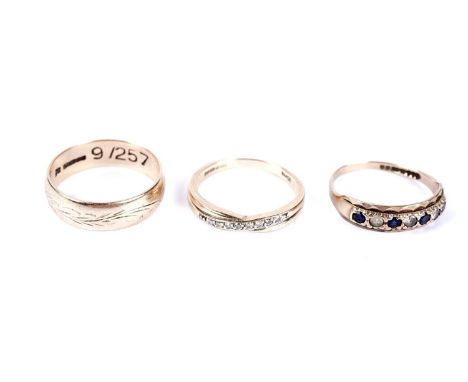 A diamond crossover band, in 9ct yellow gold, size O; a 9ct yellow gold wedding band, size P; and a blue and white stone half