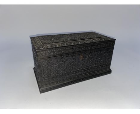 A heavily carved 19th century Anglo/Indian tea caddy, W 20cm