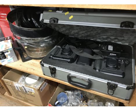 Shelf to include Nikon camera set and case and boxed items