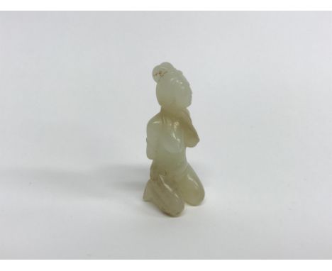 A small carved Chinese jade erotic figure of a kneeling lady, H 5cm
