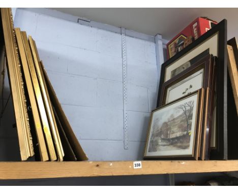 Shelf of pictures and prints