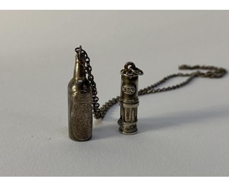 A sterling silver Newcastle Brown Ale miniature bottle charm and a miniature Miners Lamp charm (2)