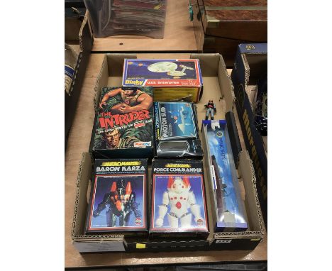 A box containing Action Man 'The Intruder', a Dinky USS Enterprise and Airfix Micronauts