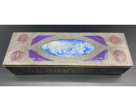White metal table jewellery box decorated central scene of dancers, embossed case with four enamel roundels, velvet interior 
