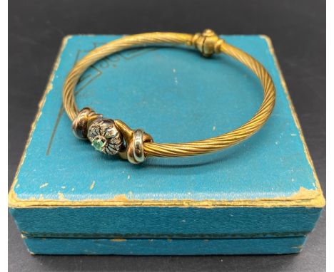 9ct gold twist bangle set with diamond &amp; emerald centre stone [14.36 grams] [6cm diameter]