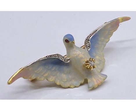 Gold, enamel and diamonds set brooch/pendant, the swooping dove clasping a small claw set diamond, diamond detail to the wing