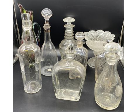 Collection of Eight vintage decanters to include three ring cut glass decanter,  whiskey and vase with cut crackled glass bow