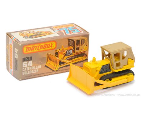 Matchbox Superfast 64d Caterpillar Bulldozer - yellow body with tan plastic cab, yellow plastic blade, bare metal engine &amp