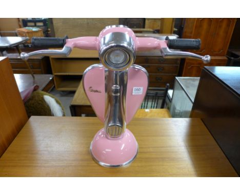 A pink Vespa table lamp