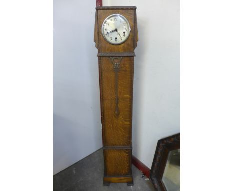 An oak dwarf longcase clock