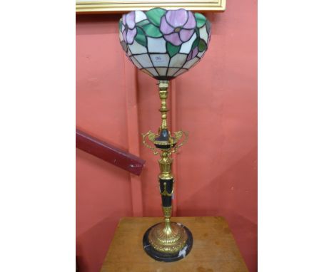 A French black marble and gilt metal table lamp with Tiffany style shade