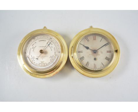 A brass cased Ships type wall clock, silvered dial signed Negretti & Zambra, London, replaced movement, diameter 17cm and a m