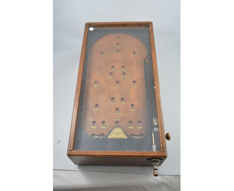 Vintage pinball game,"The Advanced Pin Table For Amusement Only", oak cased with sprung mechanism and metal bearings, overall