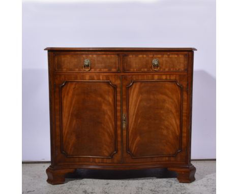 Reproduction mahogany serpentine sideboard, fitted with two drawers over two doors, ogee bracket feet, width 96cm.