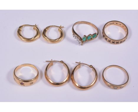 Four dress rings and two pairs of earrings, a 9 carat yellow gold garnet full eternity ring, a cubic zirconia ring, a green a