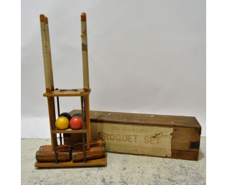 A vintage Jaques "The Hardwood Croquet Set" in wooden box with paper labels comprising:- four mallets, six hoops, two posts, 