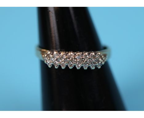 Gold triple row diamond set ring