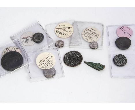 Eight Roman and antique coins, toegther with an ancient bronze arrow head, some of the coins well annontated such as a Rome S