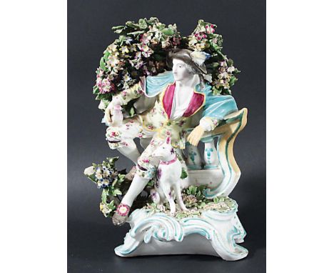 DERBY BOCAGE GROUP OF EMBLEMATIC OF LIBERTY, circa 1765-70, the man resting on a balustrade a bird on his knee and a dog at h