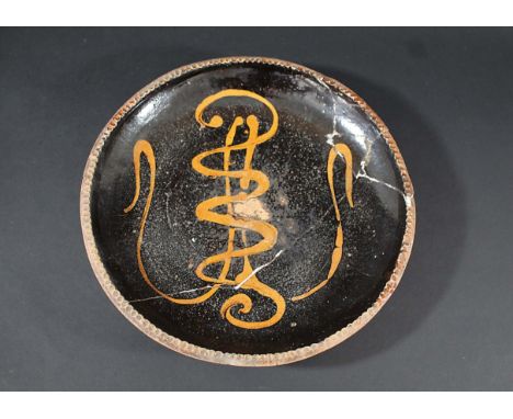 EARLY ST IVES SLIPWARE DISH - BERNARD LEACH a dish with a crimped edge and slipware glaze, with impressed St Ives seal mark. 