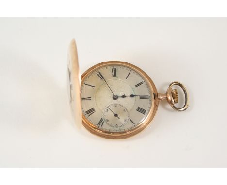 A 9CT. GOLD HALF HUNTING CASED POCKET WATCH the white enamel dial with Roman numerals and engine turned decoration, 50mm. dia