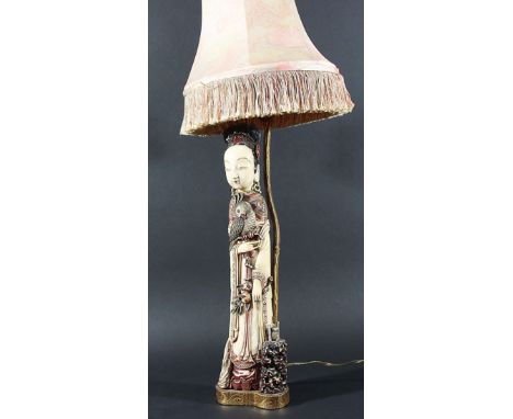 CHINESE IVORY FIGURES OF A MAIDEN, 19th century, carved standing, wearing a long gown, and holding a parrot and a branch of p
