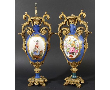 PAIR OF PORCELAIN AND ORMOLU MOUNTED LAMP BASES, 19th century, the pear shaped body painted with maidens and sheep to one sid