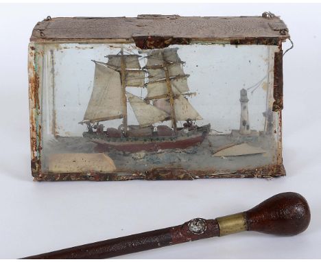 JAMES DIXON (1887-1970) - MODEL BOAT & WALKING STICK, IRISH FOLK ART INTEREST a wooden and leather clad walking stick, inset 