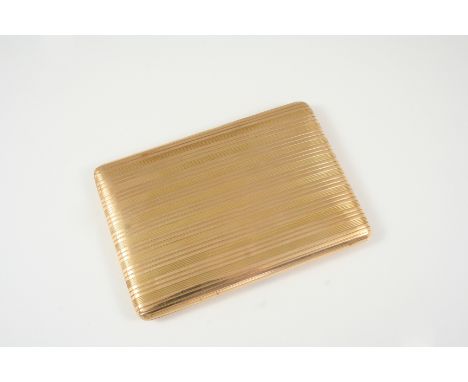 A 15CT. GOLD CIGARETTE CASE of rectangular-shape, with engine turned decoration to both sides, hallmarked for London 1928, 8.