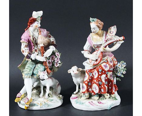 NEAR PAIR OF DERBY SHEPHERD AND SHEPHERDESS FIGURES, circa 1760-70, he seated placing the pipes with a dog at his feet, she p